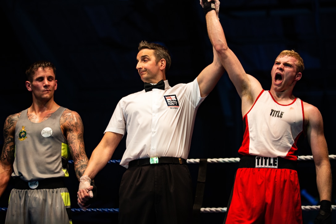 U.S. Marine Corps Cpl. Kreed Gentz, a main battle tank technician with 1st Tank Battalion and boxer with the 1st Marine Division boxing team, is declared the winner of the third bout against British Royal Marine 1st Class Aiden Thompson in a boxing competition at Commando Training Centre for the Royal Marines Lympstone, England, May 3, 2018. The 1st MARDIV boxing team and RMs were scheduled to compete in a friendly boxing exposition to strengthen the bond of both counterparts.