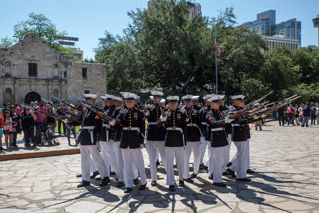 Marines with the U.S. Marine Corps Silent Drill Platoon execute their “bursting bomb” sequence during their performance as a part of a Battle Color Ceremony for the San Antonio Tricentennial Military Appreciation Day at the Alamo, San Antonio, Texas, May 6, 2018. The Military Appreciation Day was held in San Antonio to salute military history with a weekend of programming including special events, ceremonies and living history demonstrations. (Official U.S. Marine Corps photo by Sgt. Robert Knapp/Released)