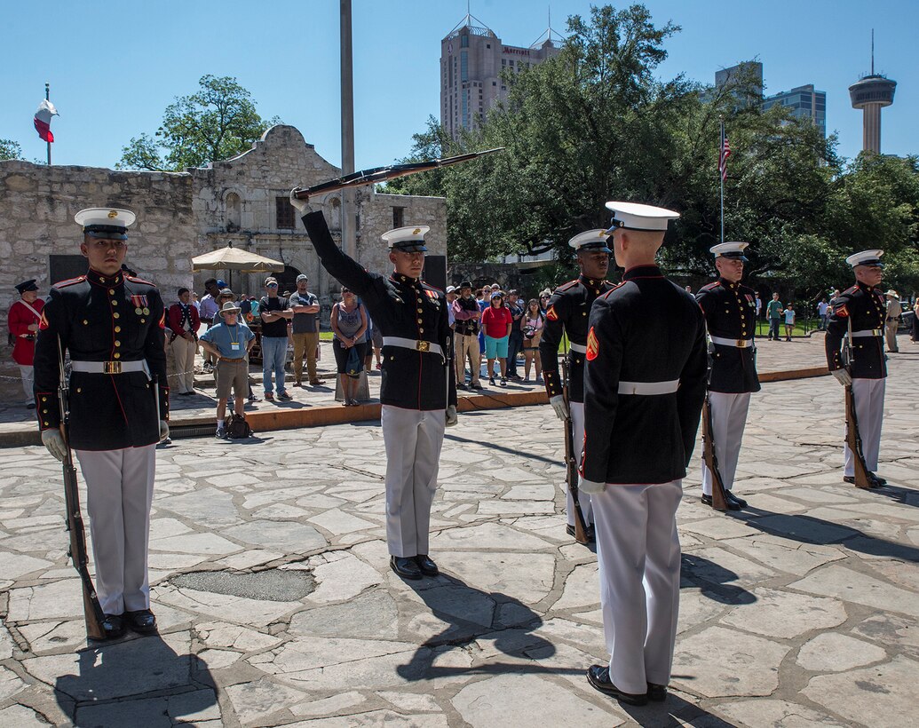 Corporal Darius Mick, inspection team, U.S. Marine Corps Silent Drill Platoon, executes precision rifle drill movements during SDP’s performance as a part of a Battle Color Ceremony for the San Antonio Tricentennial Military Appreciation Day at the Alamo, San Antonio, Texas, May 6, 2018. The Military Appreciation Day was held in San Antonio to salute military history with a weekend of programming including special events, ceremonies and living history demonstrations. (Official U.S. Marine Corps photo by Sgt. Robert Knapp/Released)