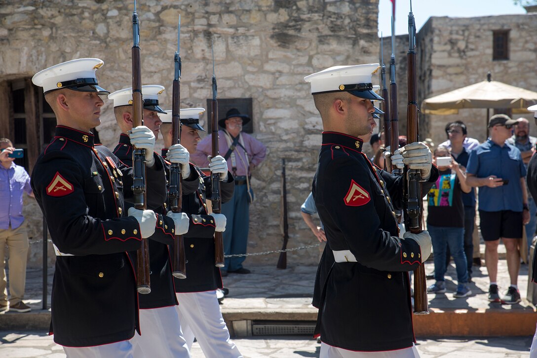 Marines with the U.S. Marine Corps Silent Drill Platoon march in formation during their performance as a part of a Battle Color Ceremony for the San Antonio Tricentennial Military Appreciation Day at the Alamo, San Antonio, Texas, May 6, 2018. The Military Appreciation Day was held in San Antonio to salute military history with a weekend of programming including special events, ceremonies and living history demonstrations. (Official U.S. Marine Corps photo by Sgt. Robert Knapp/Released)