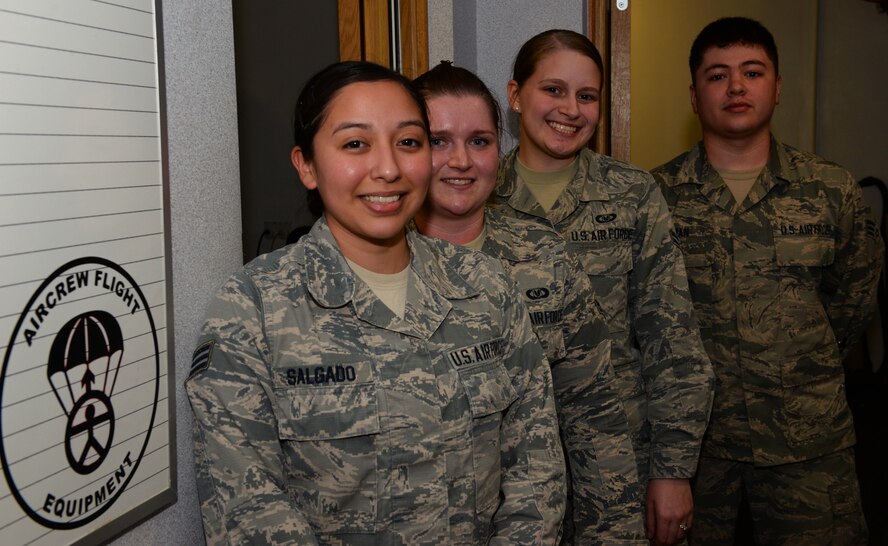 U.S. Airmen from the 100th Operations Support Squadron aircrew flight equipment shop pose for a photo at RAF Mildenhall, England, April 24, 2018. The shop keeps all the equipment up-to-date on certifications and makes sure everything is properly tested and stored. (U.S. Air Force photo by Airman 1st Class Alexandria Lee)