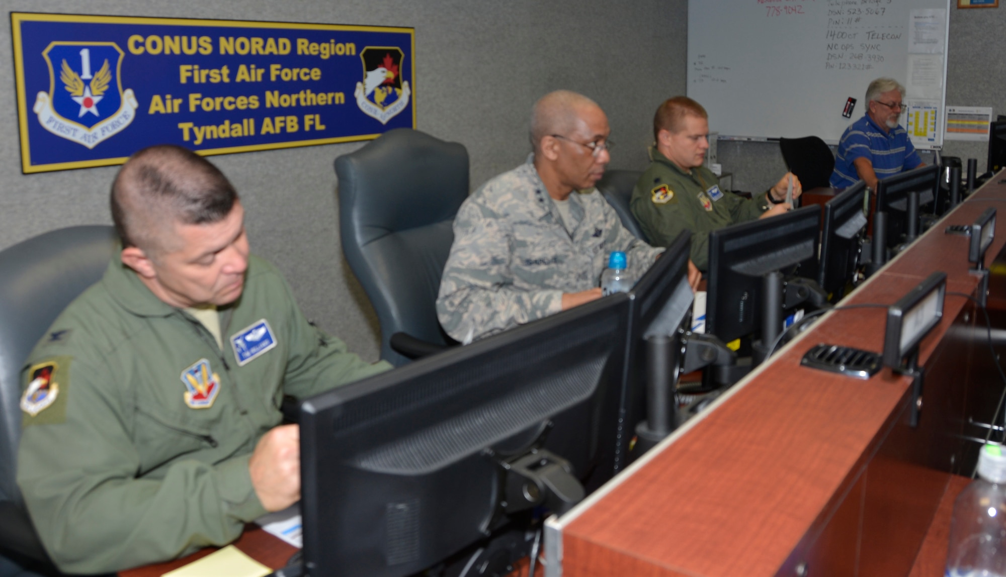 TYNDALL AIR FORCE BASE, Fla. - Maj. Gen. Leonard Isabelle Jr., (right) Air Forces Northern Joint Forces Air Component commander for  Ardent Sentry 18, a hurricane-response preparation exercise, readies for the morning briefing via teleconference here May 9. Beside him is Col. Timothy Williams, deputy director, AFNORTH Operations Directorate. (Air Force photo by Mary McHale)