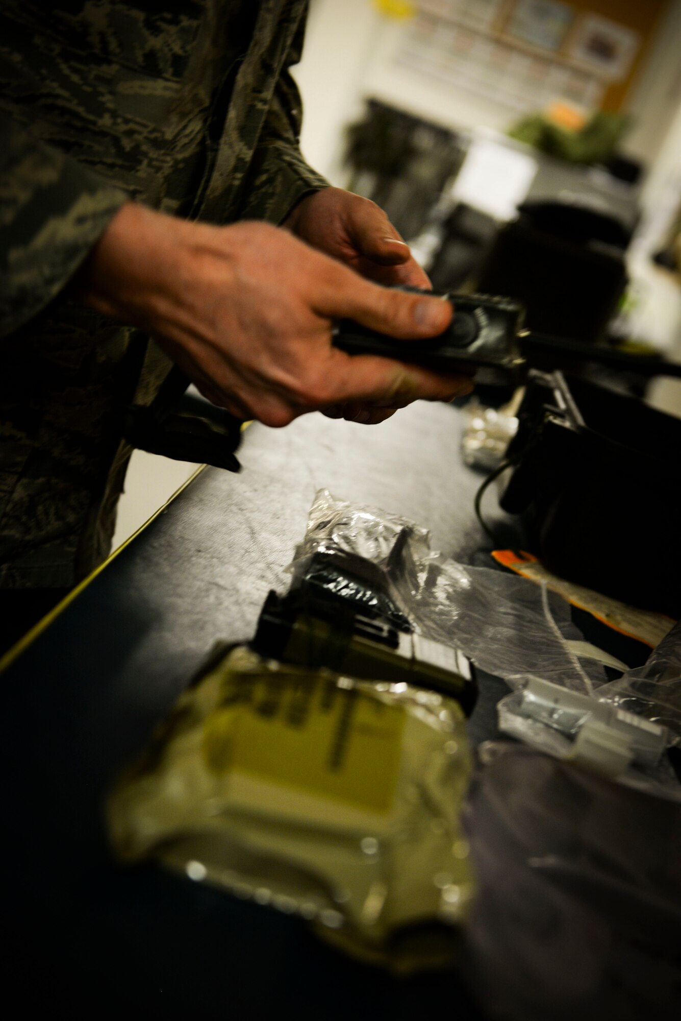 A U.S. Airman from the 100th Operations Support Squadron aircrew flight equipment shop inspects the emergency kit box for the KC-135 Stratotanker making sure all certifications are up to date at RAF Mildenhall, England, April 24, 2018. The AFE shop has a variety of equipment to keep track of, from rubber rafts to life preservers. (U.S. Air Force photo by Airman 1st Class Alexandria Lee)