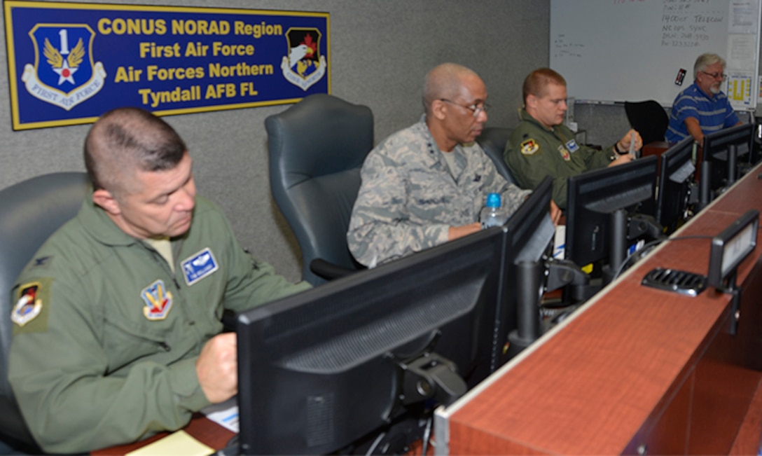 TYNDALL AIR FORCE BASE, Fla. - Maj. Gen. Leonard Isabelle Jr., (right) Air Forces Northern Joint Forces Air Component commander for  Ardent Sentry 18, a hurricane-response preparation exercise, readies for the morning briefing via teleconference here May 9. Beside him is Col. Timothy Williams, deputy director, AFNORTH Operations Directorate. (Air Force photo by Mary McHale)