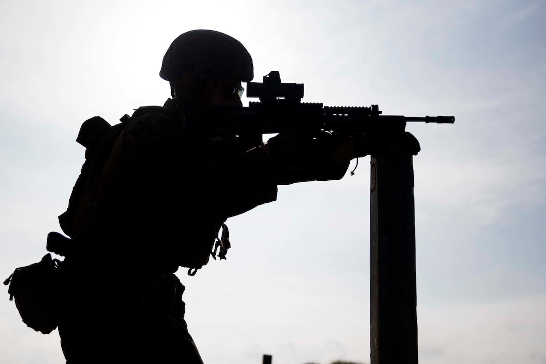 U.S. Marine Corps Sgt. Randel McCellean, combat marksmanship instructor, Marksmanship Training Company, Weapons Training Battalion, sights in with a SA80 A2 assault rifle during the Royal Marine Operational Shooting Competiton (RMOSC) at Altcar Training Camp, Hightown, United Kingdom, May 8, 2018. The U.S. Marine Corps travels to the United Kingdom annually to compete in the (RMOSC) with the opportunity to exchange operational experiences, physical and marksmanship training.