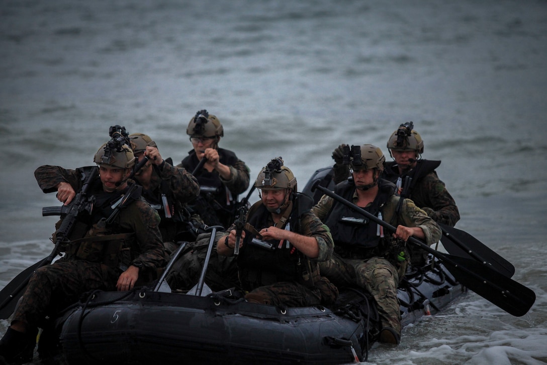 U.S. Marine Corps reconnaissance students conduct an amphibious beach assault during the Reconnaissance Team Leader Course (RTLC) aboard Marine Corps Training Area Bellows, Hawaii, May 3, 2018.  RTLC aims to improve independent and tactically sound decision-making, improving the readiness of forward deploying reconnaissance teams.