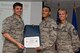 U.S. Air Force Reserve Staff Sgt. Leland Lambert, 913th Airlift Group staff, poses for a photo with Col. Christopher Lay, 913th AG commander, and Chief Master Sgt. Kimberly Lord, superintendent, 913th AG, during an All Call, May 5, 2018, at Little Rock Air Force Base, Ark.