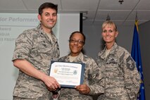 U.S. Air Force Reserve Master Sgt. Stephanie Pickens, non-commissioned officer in charge, installation personnel readiness, 913th Force Support Squadron, poses for a photo with Col. Christopher Lay, the 913th Airlift Group commander, and Chief Master Sgt. Kimberly Lord, superintendent, 913th AG, during an All Call, May 5, 2018, at Little Rock Air Force Base, Ark.