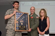U.S. Air Force Reserve Col. Christopher Lay, commander of the 913th Airlift Group, Col. Tom Guerra, inspector general, 913th AG, and his wife Kimberly, pose for a photo during the retirement presentation at Little Rock Air Force Base, Ark., May 5, 2018.