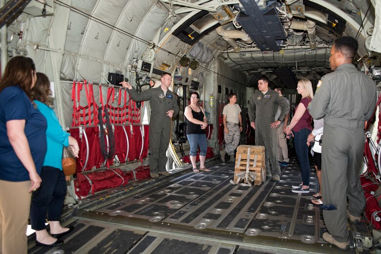 U.S. Air Force Reserve Master Sgt. Josh Hames, loadmaster, 913th Operations Support Squadron, explains the capabilities of the C-130J Super Hercules to a group of spouses at Little Rock Air Force Base, Ark., May 5, 2018.