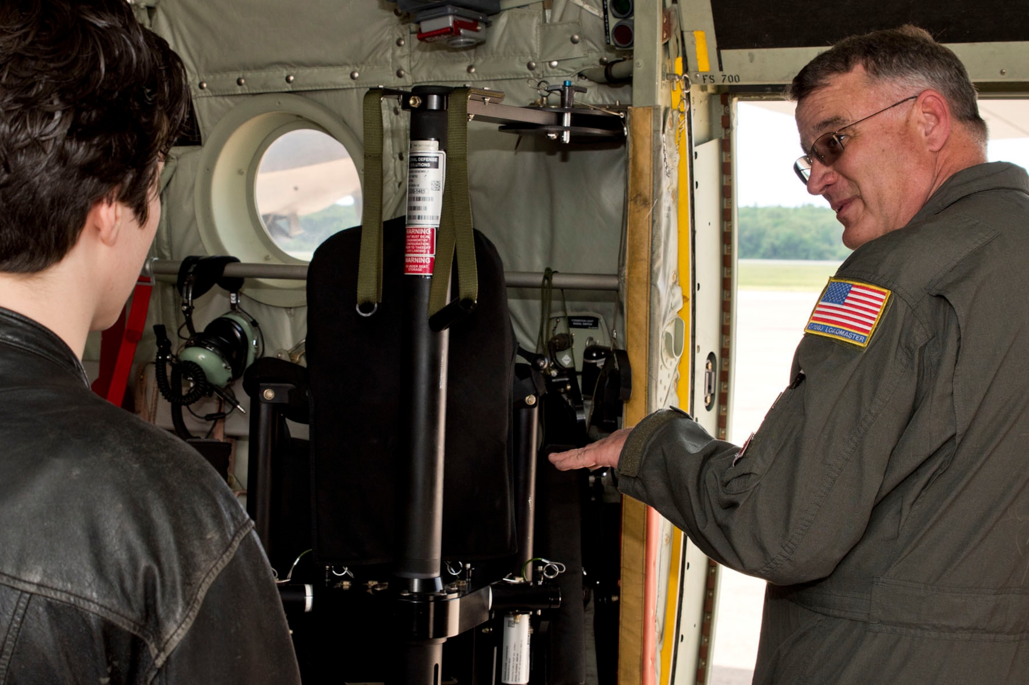 U.S. Air Force Reserve Chief Master Sgt. Donald Tarrance, superintendent for the 327th Airlift Squadron, interviews a potential loadmaster candidate in a C-130J Super Hercules, May 5, 2018, at Little Rock Air Force Base, Ark.