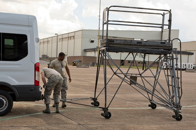 U.S. Air Force Reserve Senior Airmen Daniel Gilbert, (bending) and David Roby, hook up a B5 stand for towing May 5, 2018, at Little Rock Air Force Base, Ark.