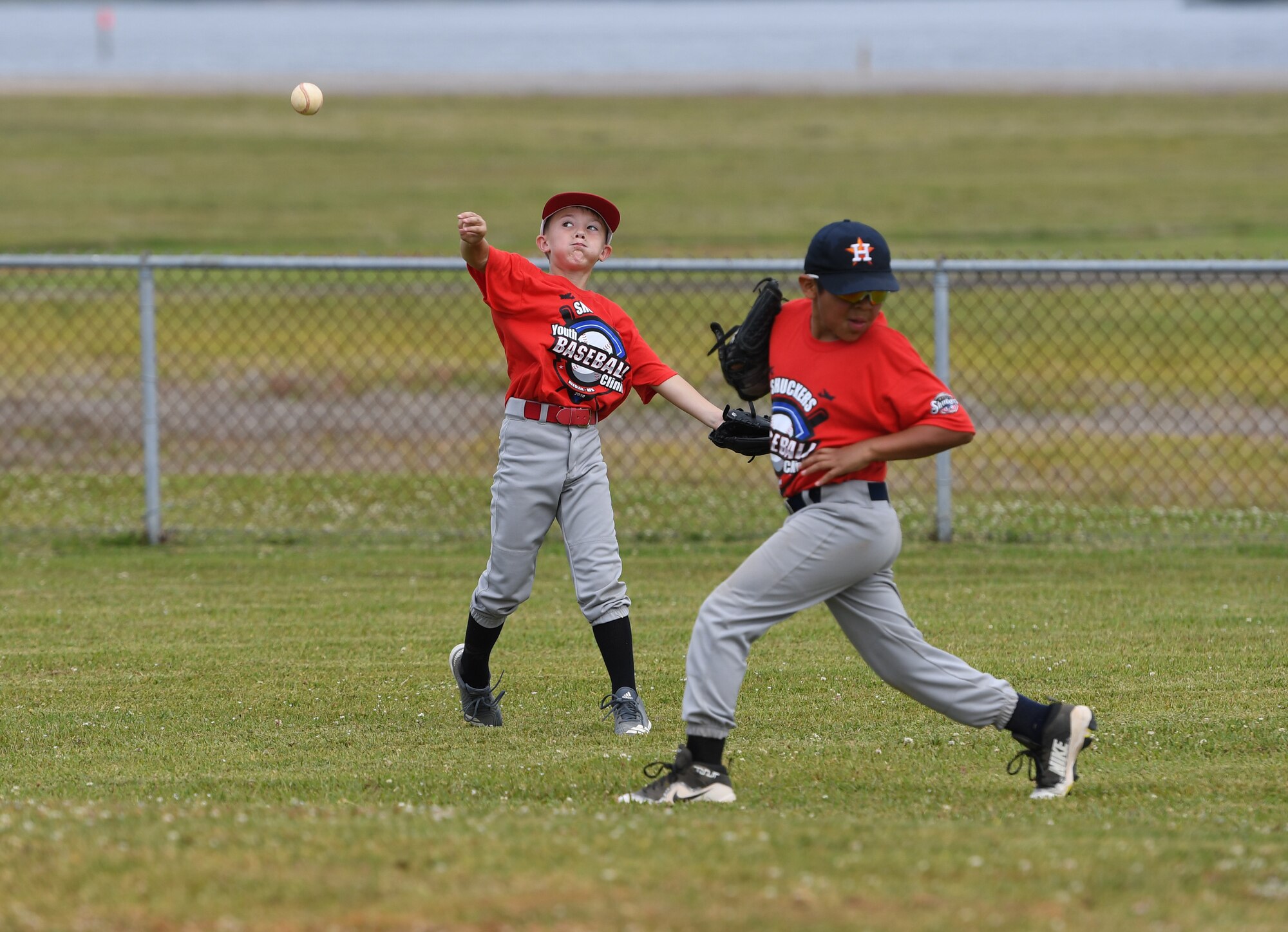 Colsen Smith, son of U.S. Air Force Master Sgt. Misty Smith, 81st Medical Group quality superintendent, and Jonathan Espinoza, son of Staff Sgt. Regina Giardini, 403rd Wing financial management comptroller technician, participate in the Biloxi Shuckers Youth Baseball Clinic  on the youth center baseball field at Keesler Air Force Base, Mississippi, May 5, 2018. The clinic provided hitting, pitching, base running and fielding instruction from members of the Biloxi Shuckers minor league baseball team. (U.S. Air Force photo by Kemberly Groue)