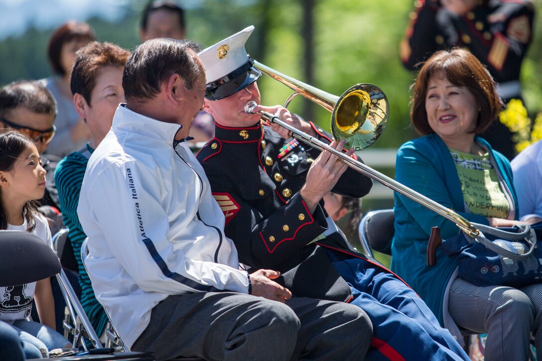 Sgt. Colin Deeter performs for members of the local community May 4 at Juku No Mori in Shizuoka, Japan. The III Marine Expeditionary Force band performed in support of Combined Arms Forces Training Camp Fuji’s community engagement plan, building bridges between the local and military community through the international language of music. The Marines made a point to interact with the audience, giving them instruments to play, and performing throughout the crowd. Deeter is a member of the III MEF Band. (U.S. Marine Photo by Cpl. Tayler P. Schwamb)