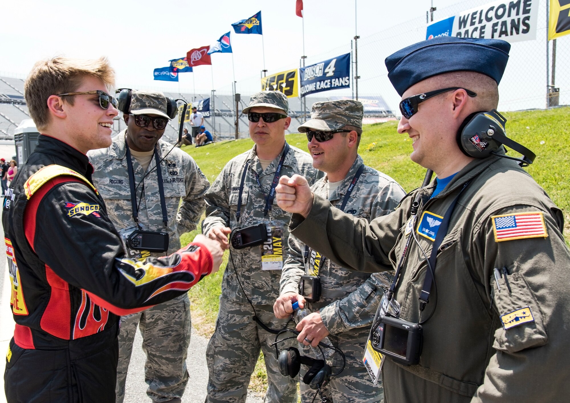 Myatt Snider, left, NASCAR Camping World Truck Series driver for the No. 13 ThorSport Racing Louisiana Hot Sauce Ford, fist bumps Senior Airman Eric Jones, 3rd Airlift Squadron loadmaster, May 4, 2018, at Dover International Speedway, Dover, Del. Snider spoke with honorary pit crew members prior to qualifying for the 19th Annual “JEGS 200” race later that afternoon. (U.S. Air Force photo by Roland Balik)
