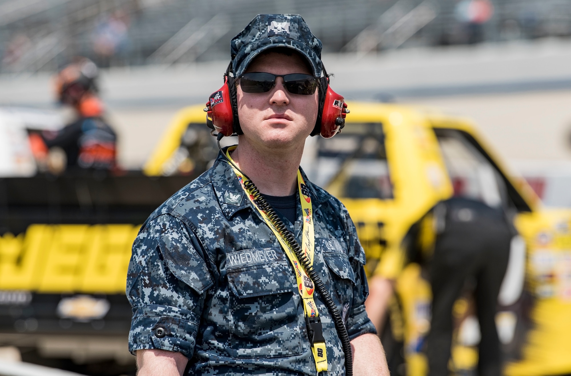 Hospital Corpsman 3rd Class Tyler Wiedmeyer, Armed Forces Medical Examiner System histopathology technician, watches NASCAR Camping World Truck Series trucks prepare for a qualifying session May 4, 2018, at Dover International Speedway, Dover, Del. Wiedmeyer and other honorary pit crew members had access to pit road and spoke with drivers and crew members prior to qualifying for the 19th Annual “JEGS 200” race later that afternoon. (U.S. Air Force photo by Roland Balik)