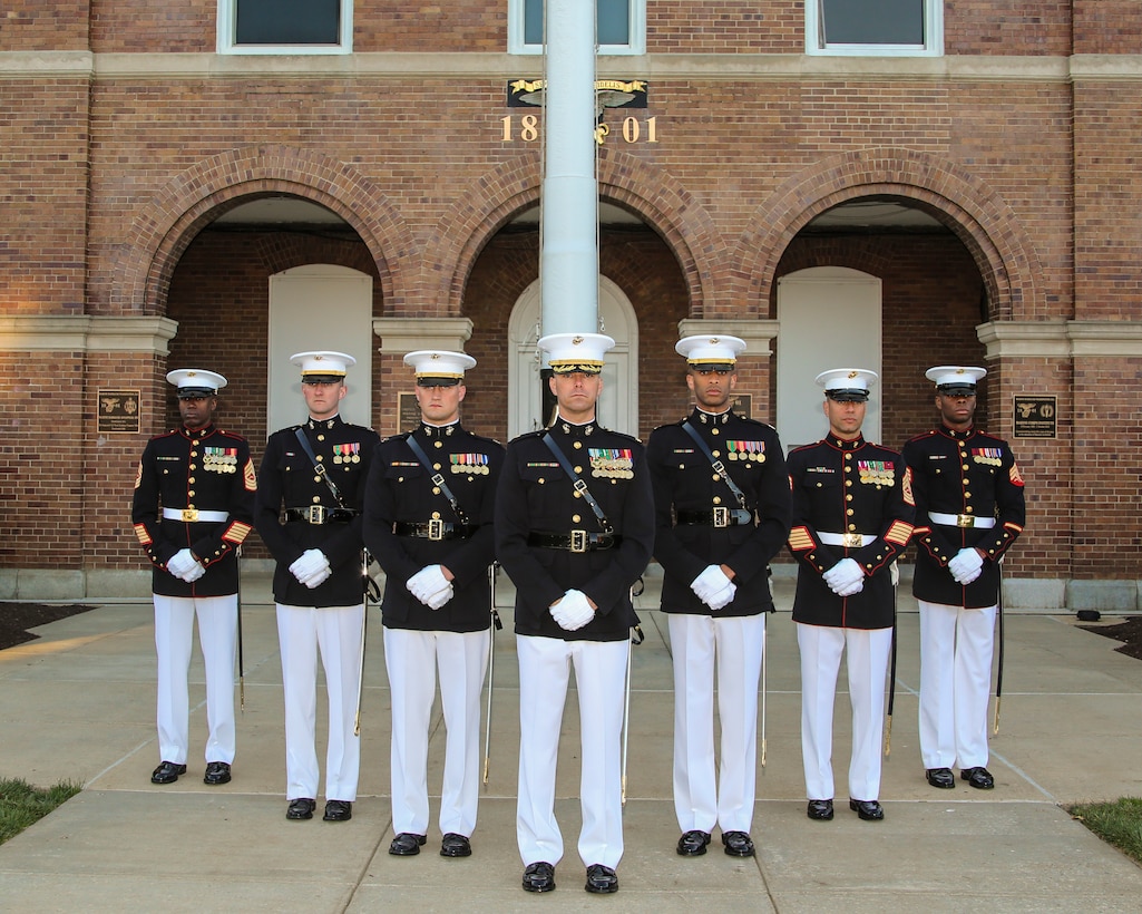 Marines with the Marine Barracks Washington D.C. Parade Marching Staff pose for a photo at the Barracks, May 1, 2018. (Official U.S. Marine Corps photo by Cpl. Damon Mclean/Released)