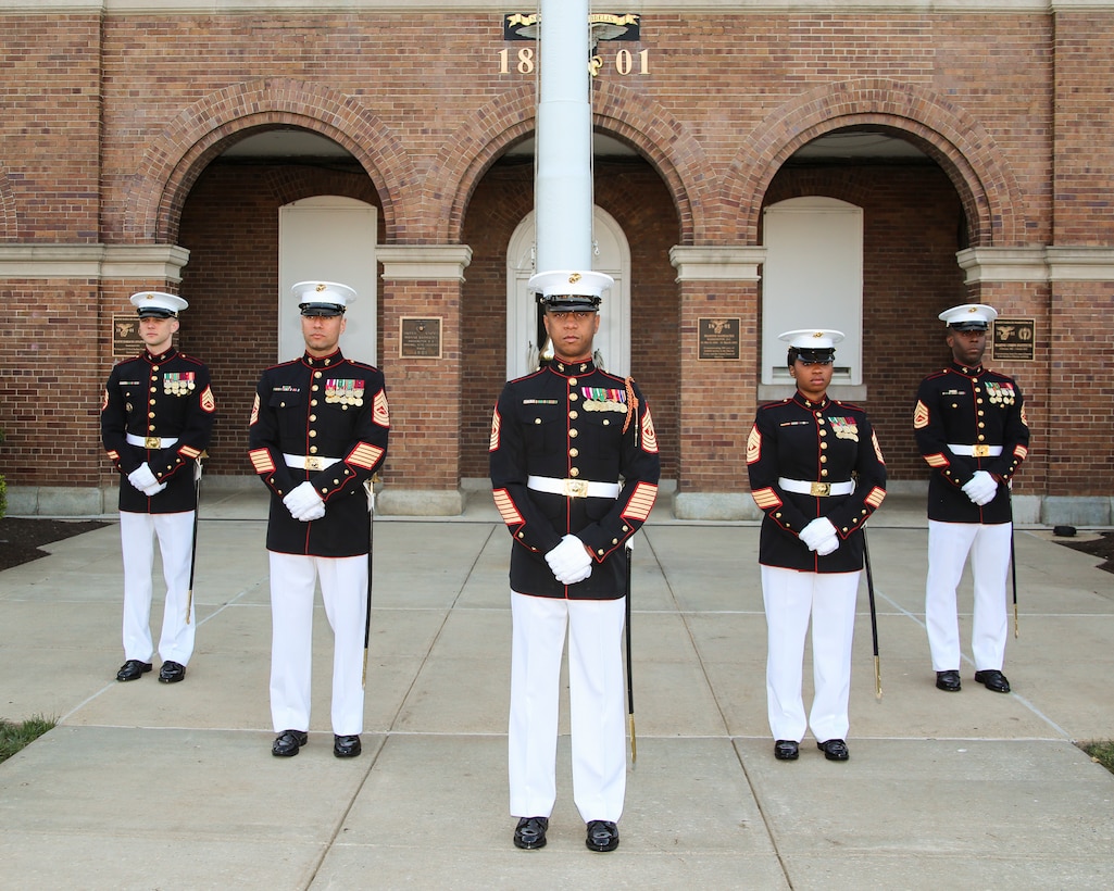 Marines with the Marine Barracks Washington D.C. Staff Non-Commissioned Officer Parade Marching Staff pose for a photo at the Barracks, May 1, 2018. (Official U.S. Marine Corps photo by Cpl. Damon Mclean/Released)