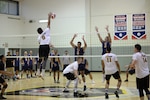 HURLBURT FIELD, Fla. –  Spc. Froydan DeLeon, with the Army Men’s volleyball team, spikes the volleyball towards the Navy Men’s defense. Elite U.S. military volleyball players from around the world compete for dominance at Hurlburt Field’s Aderholt Fitness Center May 7-11, 2018 to determine the best of the best at the 2018 Armed Forces Volleyball Championship. Army, Navy (with Coast Guard) and Air Force teams squared off at the annual AFVC through three days of round-robin competition, to eventually crown the best men and women volleyball players in the military. U.S. Navy photo by Mass Communication Specialist 2nd Class John Benson (Released)