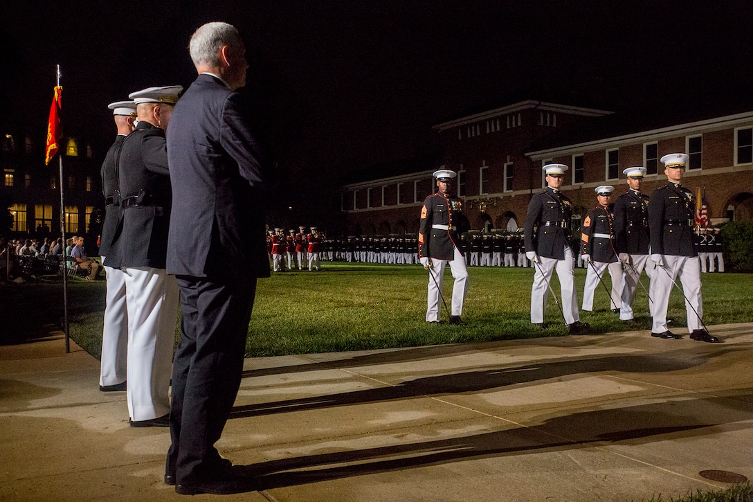 Vice President Mike Pence, Commandant of the Marine Corps, Gen. Robert B. Neller and Col. Tyler J. Zagurski, commanding officer, Marine Barracks Washington D.C., render honors at the conclusion of an Evening Parade at the Barracks, May 4, 2018. The Friday Evening Parade was the first of the 2018 season. The vice president was the guest of honor, and the parade was hosted by Commandant of the Marine Corps Gen. Robert B. Neller.  (U.S. Marine Corps photo by Sgt. Robert Knapp/Released)