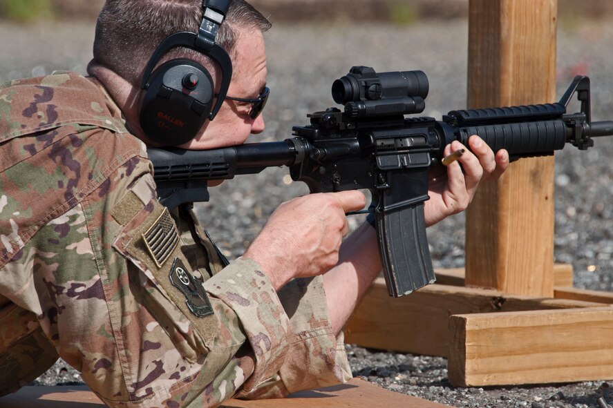 Chief Master Sgt. James Loper, 10th Air Force Command Chief, qualifies on the M-4 rifle
