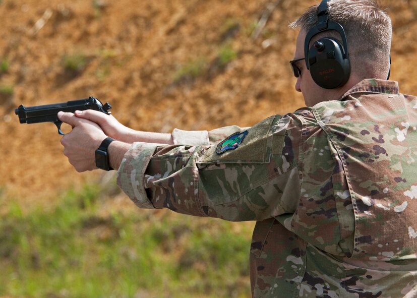 Chief Master Sgt. James Loper, 10th Air Force Command Chief, qualifies on the M-9 pistol May 3, 2018 during his four-day visit to Duke Field, Florida