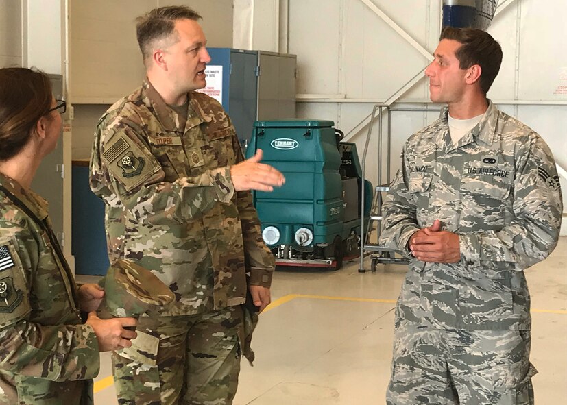 Chief Master Sgt. James Loper, 10th Air Force Command Chief, meets Senior Airman Kerstan Chojnacki, 919th Special Operations Aircraft Maintenance Squadron