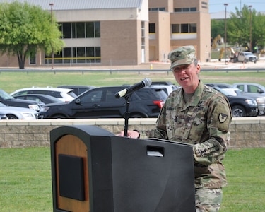 Col. Lynda Armer addresses members of the 418th Contracting Support Brigade, military leaders, families and friends during an uncasing ceremony April 20 at Fort Hood, Texas. The uncasing of organizational colors signals the return from deployment to Afghanistan for the unit. Armer is the 418th CSB commander.