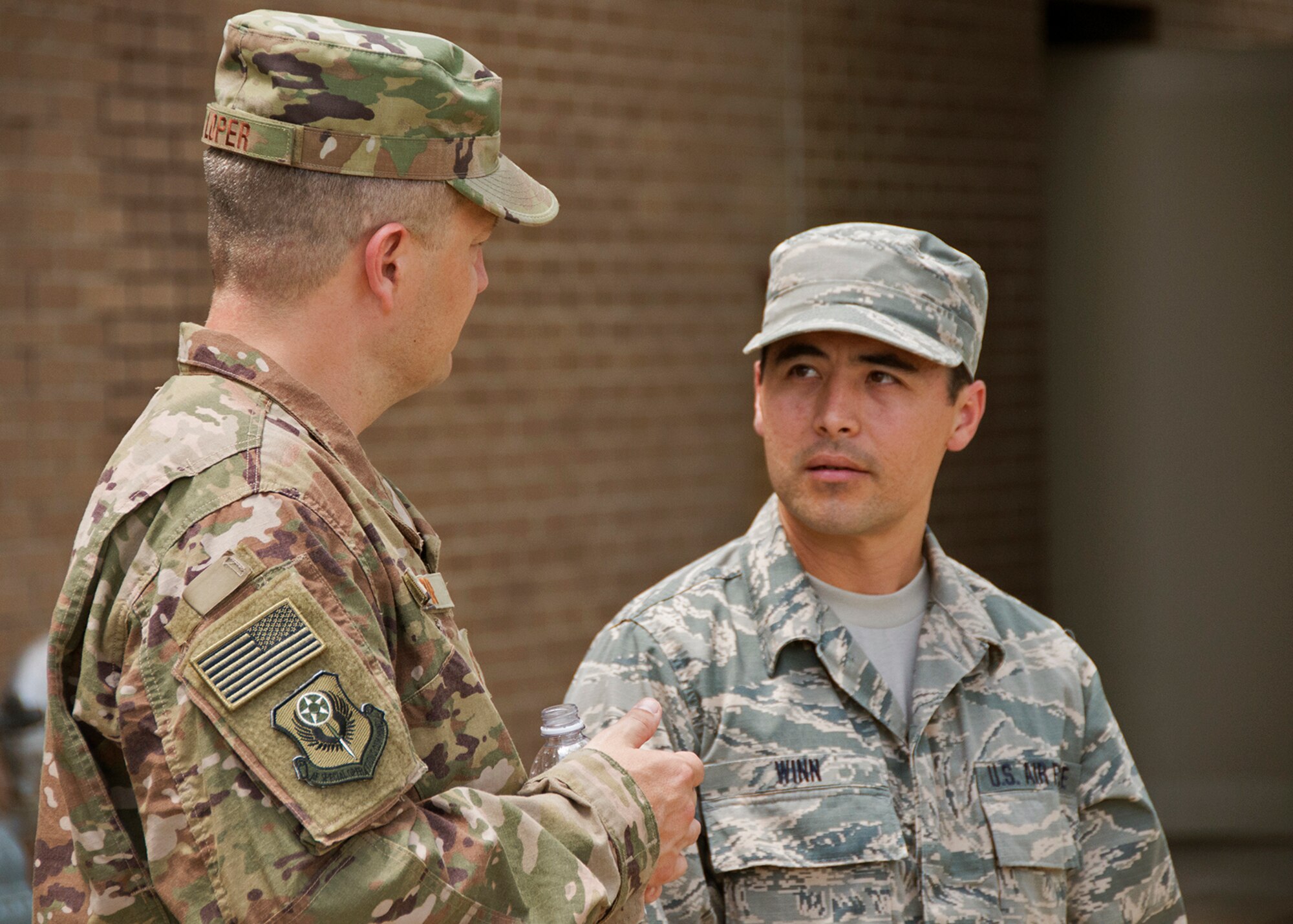 Chief Master Sgt. James Loper, 10th Air Force Command Chief, meets Tech. Sgt. Kent Winn, 919th Special Operations Communications Squadron