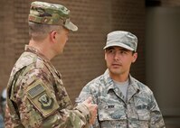 Chief Master Sgt. James Loper, 10th Air Force Command Chief, meets Tech. Sgt. Kent Winn, 919th Special Operations Communications Squadron