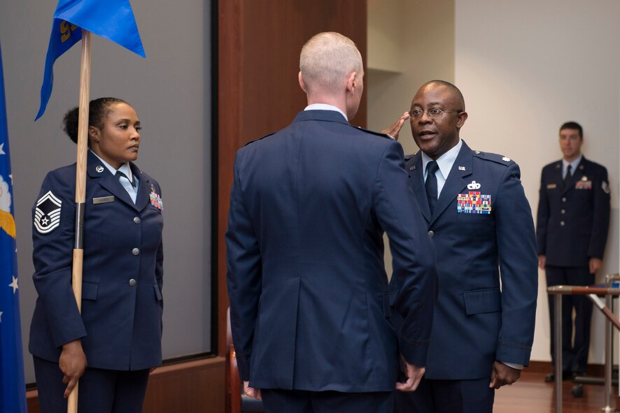 Lt. Col. Christopher Hall, 709th Support Squadron commander, renders a salute to Col. Richard Mendez, 709th Support Group commander, after taking command of the newly-formed squadron within the Air Force Technical Applications Center, Patrick AFB, Fla.  Also pictured (left) is Senior Master Sgt. Shannon S. Harris, 709th SPTS superintendent.  (U.S. Air Force photo by Matthew S. Jurgens)