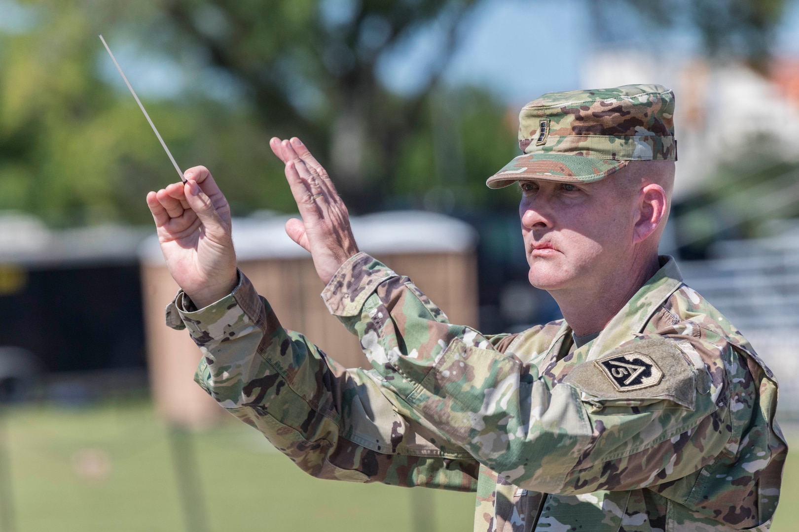 The 323d Army Band “Fort Sam’s Own” conductor leads the band during the annual Military Appreciation Weekend May 6, 2017 at Joint Base San Antonio-Fort Sam Houston, Texas. U.S. Army North and JBSA hosted the two-day event, which featured music, family activities, and various military demonstrations. This year, the appreciation weekend also commemorated the 300th anniversary for the city of San Antonio. (U.S. Air Force photo by Ismael Ortega / Released)