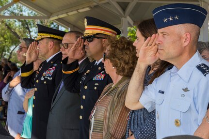 Joint Base San Antonio and community members render honors as the national anthem plays during the annual Military Appreciation Weekend May 6, 2017 at Joint Base San Antonio-Fort Sam Houston, Texas. U.S. Army North and JBSA hosted the two-day event, which featured music, family activities, and various military demonstrations. This year, the appreciation weekend also commemorated the 300th anniversary for the city of San Antonio. (U.S. Air Force photo by Ismael Ortega / Released)