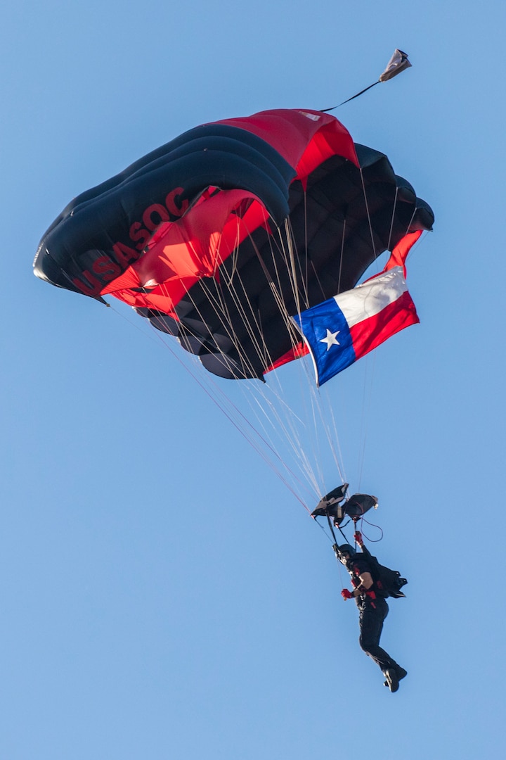 A U.S. Army Special Operations Command “Black Daggers” Parachute Team member descends during the annual Military Appreciation Weekend May 6, 2017 at Joint Base San Antonio-Fort Sam Houston, Texas. U.S. Army North and JBSA hosted the two-day event, which featured music, family activities, and various military demonstrations. This year, the appreciation weekend also commemorated the 300th anniversary for the city of San Antonio. (U.S. Air Force photo by Ismael Ortega / Released)