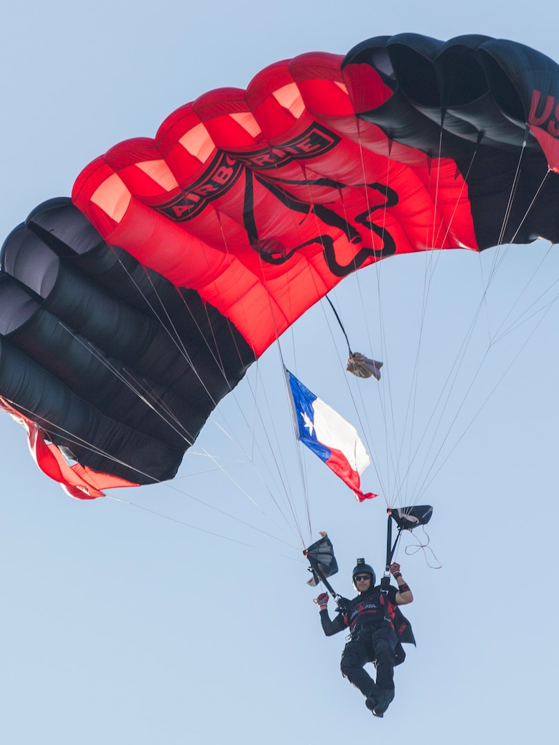 A U.S. Army Special Operations Command “Black Daggers” Parachute Team member descends during the annual Military Appreciation Weekend May 6, 2017 at Joint Base San Antonio-Fort Sam Houston, Texas. U.S. Army North and JBSA hosted the two-day event, which featured music, family activities, and various military demonstrations. This year, the appreciation weekend also commemorated the 300th anniversary for the city of San Antonio. (U.S. Air Force photo by Ismael Ortega / Released)