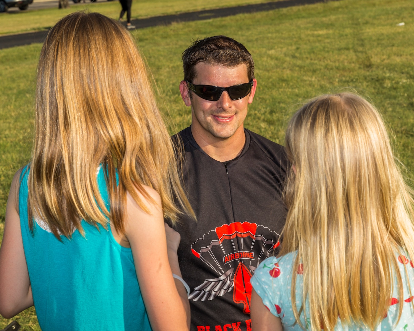 A U.S. Army Special Operations Command “Black Daggers” Parachute Team member talks with community members during the annual Military Appreciation Weekend May 6, 2017 at Joint Base San Antonio-Fort Sam Houston, Texas. U.S. Army North and JBSA hosted the two-day event, which featured music, family activities, and variou military demonstrations. This year, the appreciation weekend also commemorated the 300th anniversary for the city of San Antonio. (U.S. Air Force photo by Ismael Ortega / Released)