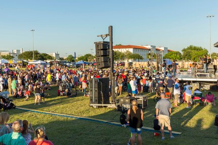 Team Joint Base San Antonio and community members attend an Aaron Watson concert during the annual Military Appreciation Weekend May 6, 2017 at Joint Base San Antonio-Fort Sam Houston, Texas. U.S. Army North and JBSA hosted the two-day event, which featured music, family activities, and various military demonstrations. This year, the appreciation weekend also commemorated the 300th anniversary for the city of San Antonio. (U.S. Air Force photo by Ismael Ortega / Released)