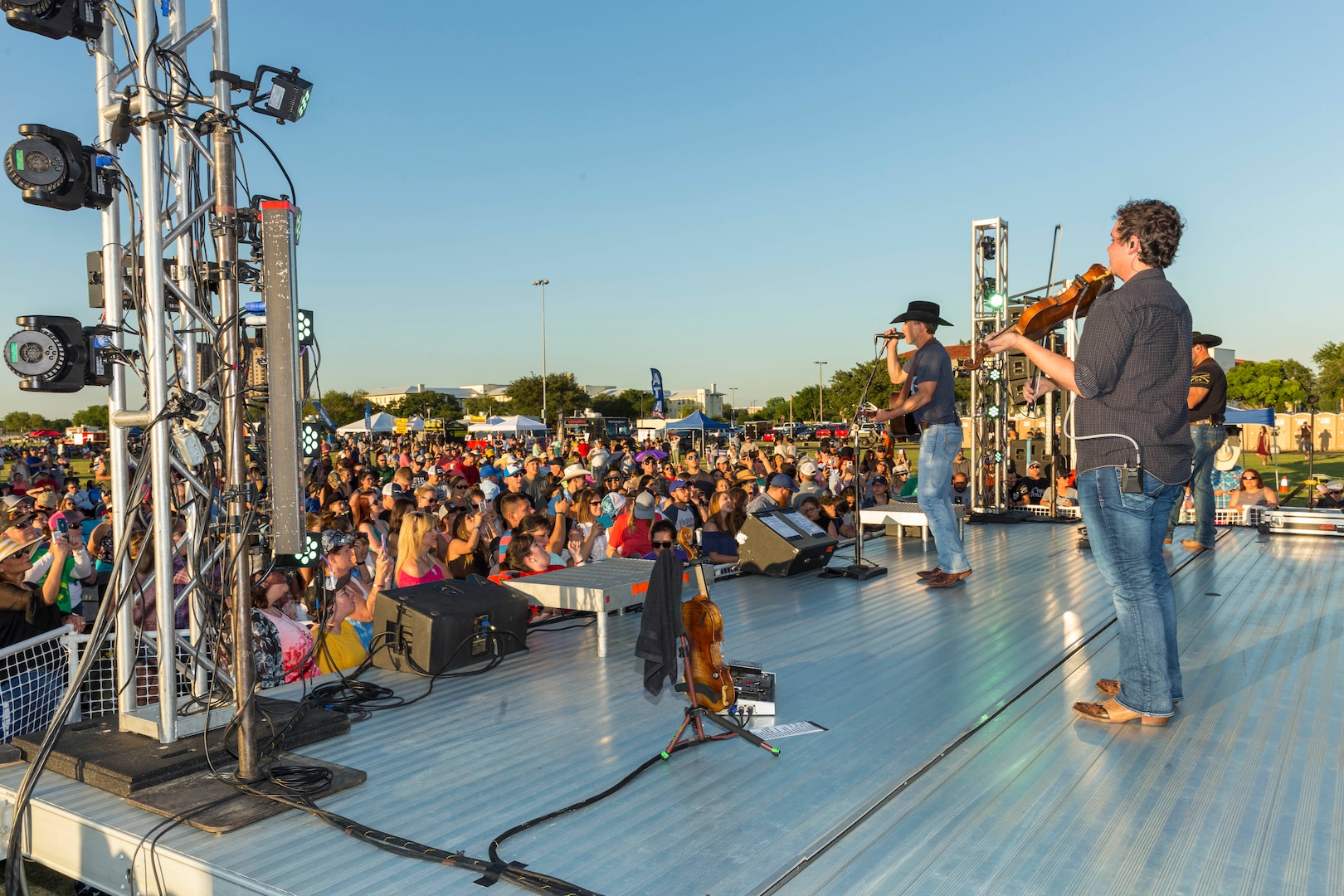 Team Joint Base San Antonio and community members attend an Aaron Watson concert during the annual Military Appreciation Weekend May 6, 2017 at Joint Base San Antonio-Fort Sam Houston, Texas. U.S. Army North and JBSA hosted the two-day event, which featured music, family activities, and various military demonstrations. This year, the appreciation weekend also commemorated the 300th anniversary for the city of San Antonio. (U.S. Air Force photo by Ismael Ortega / Released)