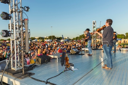 Team Joint Base San Antonio and community members attend an Aaron Watson concert during the annual Military Appreciation Weekend May 6, 2017 at Joint Base San Antonio-Fort Sam Houston, Texas. U.S. Army North and JBSA hosted the two-day event, which featured music, family activities, and various military demonstrations. This year, the appreciation weekend also commemorated the 300th anniversary for the city of San Antonio. (U.S. Air Force photo by Ismael Ortega / Released)