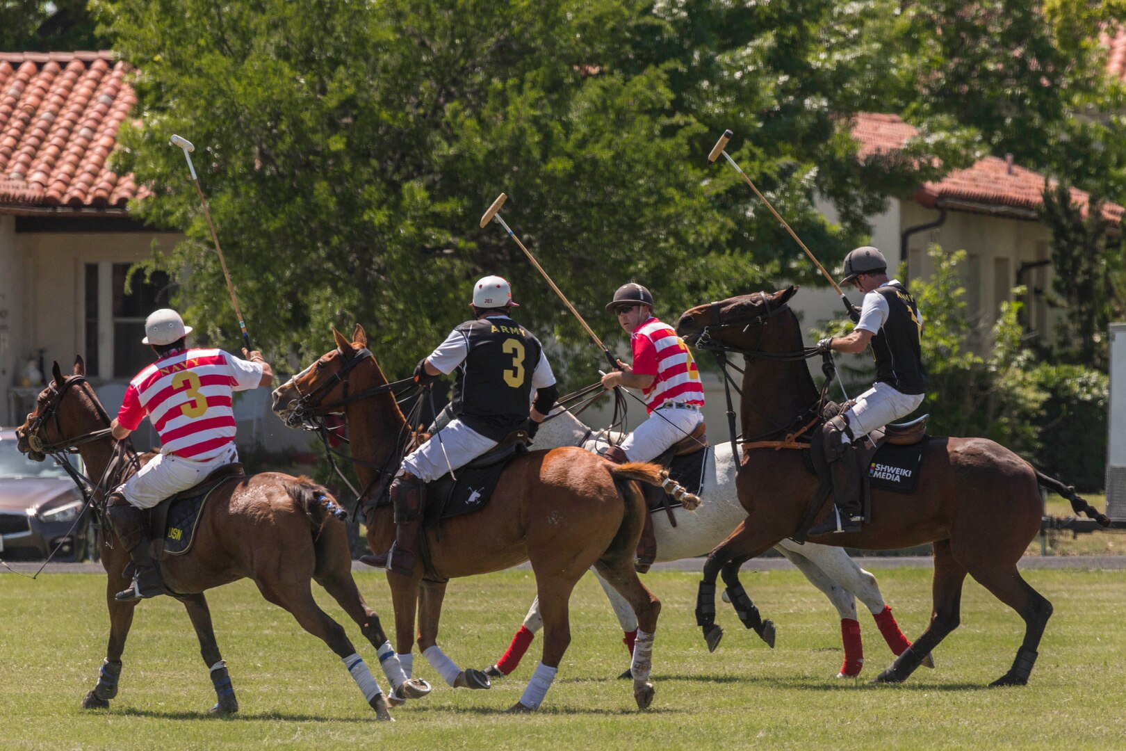 U.S. Army and Navy polo teams compete against one another during the annual Military Appreciation Weekend May 6, 2017 at Joint Base San Antonio-Fort Sam Houston, Texas. U.S. Army North and JBSA hosted the two-day event, which featured music, family activities, and various military demonstrations. This year, the appreciation weekend also commemorated the 300th anniversary for the city of San Antonio. (U.S. Air Force photo by Ismael Ortega / Released)