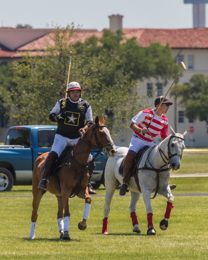 U.S. Army and Navy polo teams compete against one another during the annual Military Appreciation Weekend May 6, 2017 at Joint Base San Antonio-Fort Sam Houston, Texas. U.S. Army North and JBSA hosted the two-day event, which featured music, family activities, and various military demonstrations. This year, the appreciation weekend also commemorated the 300th anniversary for the city of San Antonio. (U.S. Air Force photo by Ismael Ortega / Released)