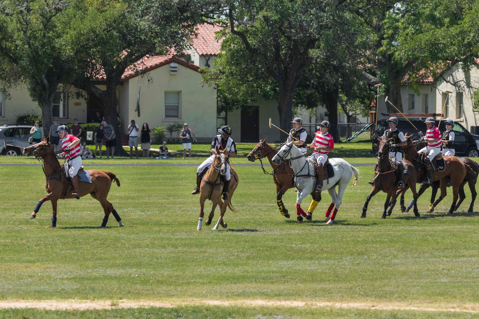 U.S. Army and Navy polo teams compete against one another during the annual Military Appreciation Weekend May 6, 2017 at Joint Base San Antonio-Fort Sam Houston, Texas. U.S. Army North and JBSA hosted the two-day event, which featured music, family activities, and various military demonstrations. This year, the appreciation weekend also commemorated the 300th anniversary for the city of San Antonio. (U.S. Air Force photo by Ismael Ortega / Released)