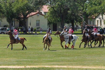 U.S. Army and Navy polo teams compete against one another during the annual Military Appreciation Weekend May 6, 2017 at Joint Base San Antonio-Fort Sam Houston, Texas. U.S. Army North and JBSA hosted the two-day event, which featured music, family activities, and various military demonstrations. This year, the appreciation weekend also commemorated the 300th anniversary for the city of San Antonio. (U.S. Air Force photo by Ismael Ortega / Released)