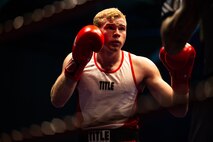 U.S. Marine Corps Cpl. Kreed Gentz, a main battle tank technician with 1st Tank Battalion and boxer with the 1st Marine Division (MARDIV) boxing team, faces his opponent, British Royal Marine (RM) 1st Class Aiden Thompson at Commando Training Centre for the Royal Marines Lympstone, England, May 3, 2018.