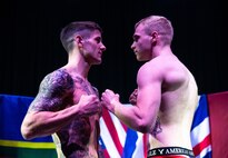 U.S. Marine Corps Lance Cpl. Kreed Gentz, right, a main battle tank technician with 1st Tank Battalion, 1st Marine Division (MARDIV), and boxer with the 1st MARDIV boxing team, faces his opponent British Royal Marine (RM) 1st Class Aiden Thompson, at the Commando Training Centre for the Royal Marines Lympstone, England, May 3, 2018.