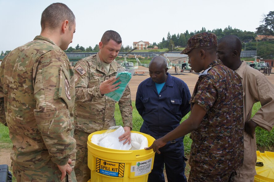 Master Sgt. James Hoskins, 818th Mobility Support Advisory Squadron air advisor, instructs basic fuels management principles and environmental safety precautions to Ugandan People’s Defense Air Force as part of a mobile training team mission in Entebbe, Uganda, Dec. 14, 2017. The 818th MSAS last conducted a traveling contact team with the UPDAF in December 2016 whereby representatives of the U.S. Air Force and the UPDAF exchanged best practices focused on principles of petroleum, oil, and lubricants. This engagement sought to further the discussion with hands-on training in the hazards of petroleum products and prevention, laboratory analysis, and the fuels safety servicing zone. (Courtesy photo)