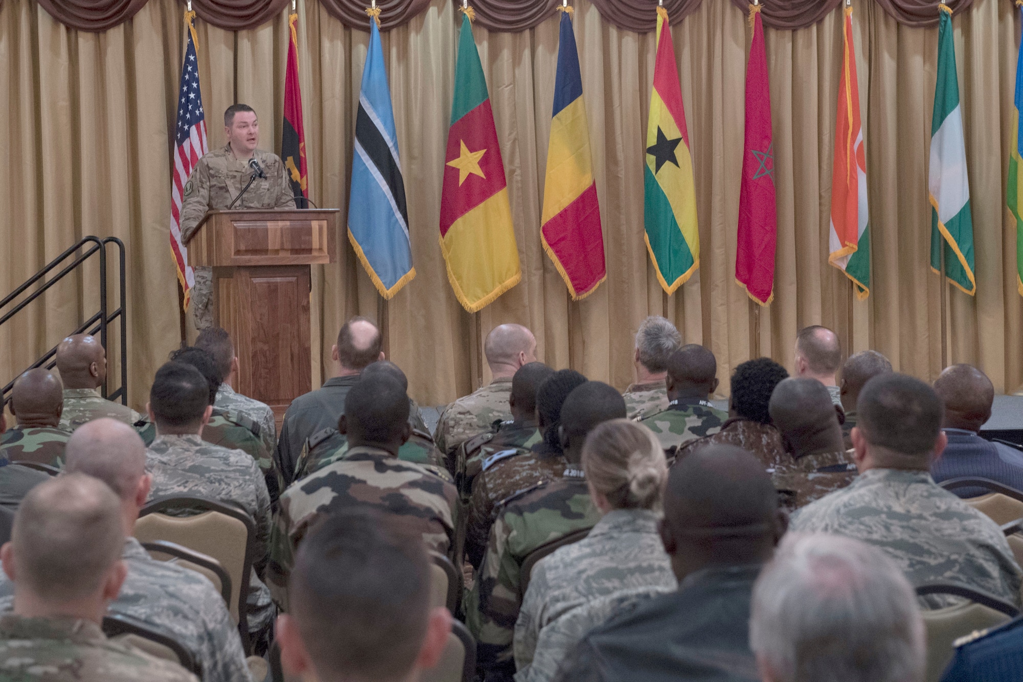 Master Sgt. James Hoskins, 818th Mobility Support Advisory Squadron air advisor, briefs African military members during the African Partnership Flight program, hosted by the 621st Contingency Response Wing at Joint Base McGuire-Dix-Lakehurst, N.J., Apr. 16, 2018. The program is sponsored and developed by U.S. Air Forces Africa and is the premier security cooperation program which partners U.S. and African personnel to improve professional military aviation knowledge, skills and cooperation. (U.S. Air Force photo by Tech. Sgt. Gustavo Gonzalez)