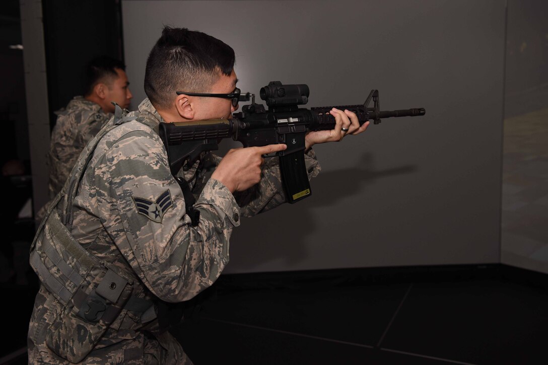 Members of the 30th Security Forces Squadron participate in the Virtual Reality Simulation to practice real life scenarios on May 3, 2018 at Vandenberg Air Force Base, Calif. Virtual Reality Simulation is a part of 30th SFS’s month of training and inside the simulation a team of two will be given scenarios which they must react according to procedures to pass. (U.S. Air Force photo by Airman Aubree Milks/Released)