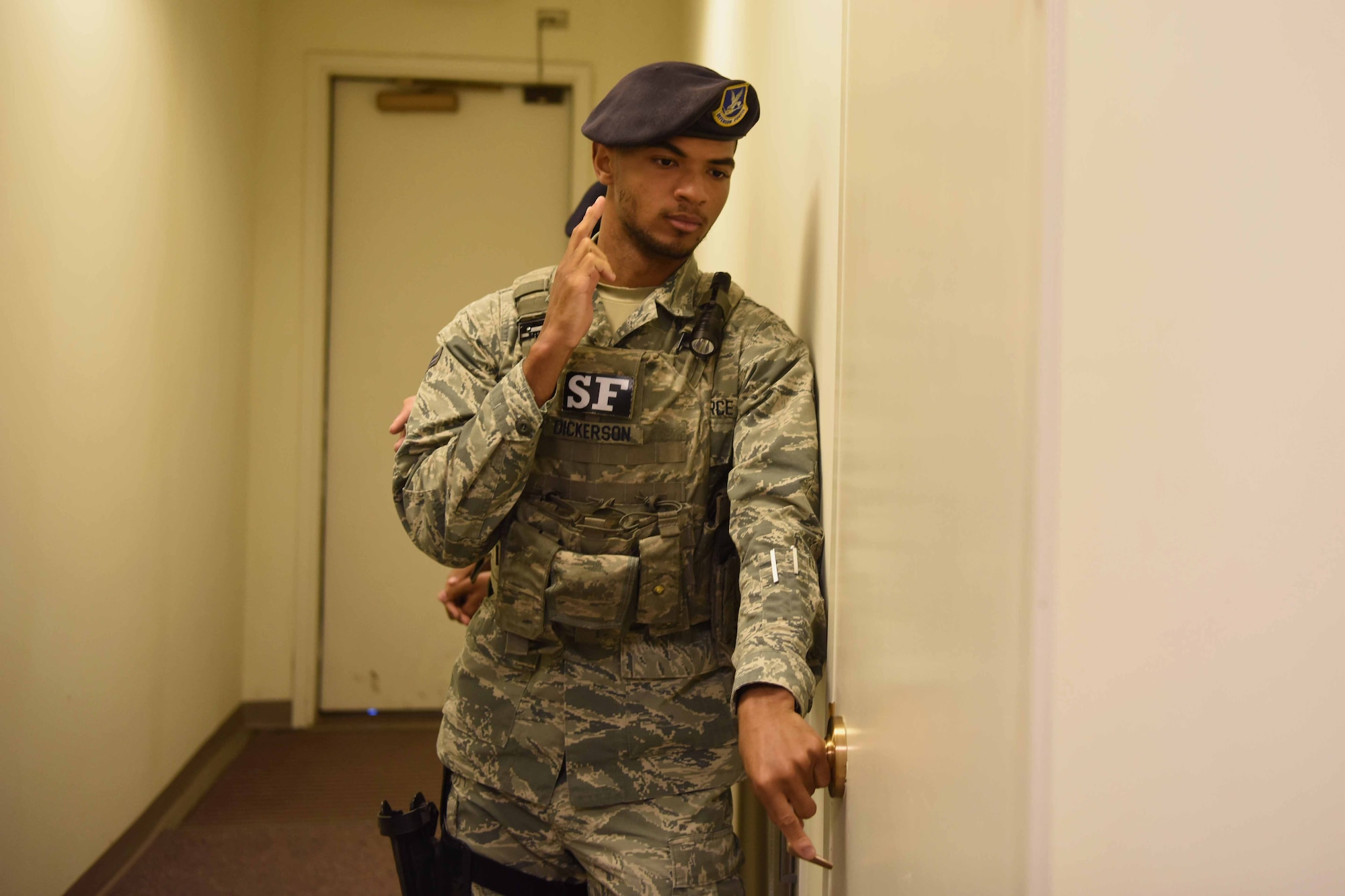 Airman 1st Class Aaron Dickerson, 30th Security Forces Squadron apprentice, checks all rooms in the building with two partners on May 3, 2018 at Vandenberg Air Force Base, Calif. Defenders practiced room clearing techniques during a month of training to improve their ability to shoot, move and communicate. (U.S. Air Force photo by Airman Aubree Milks/Released)