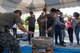 Koku Jietai, Japanese Air Self-Defense Force, service members demonstrate mochi pounding for the students as part of the National Asian American and Pacific Islander Heritage Celebration at Yokota High School, Yokota Air Base, Japan, May 3, 2018.